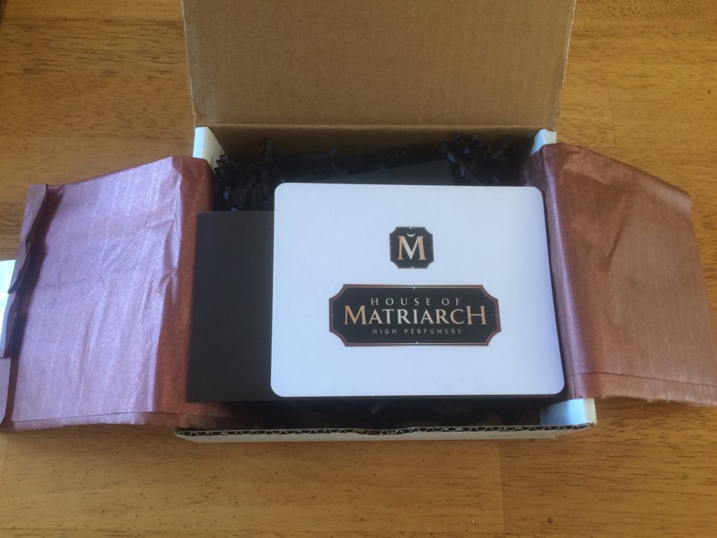 under the tissue paper of House of Matriarch perfume unboxing